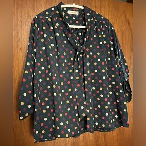 Forest green blouse with multicolored polka dots and attached tie/bow.